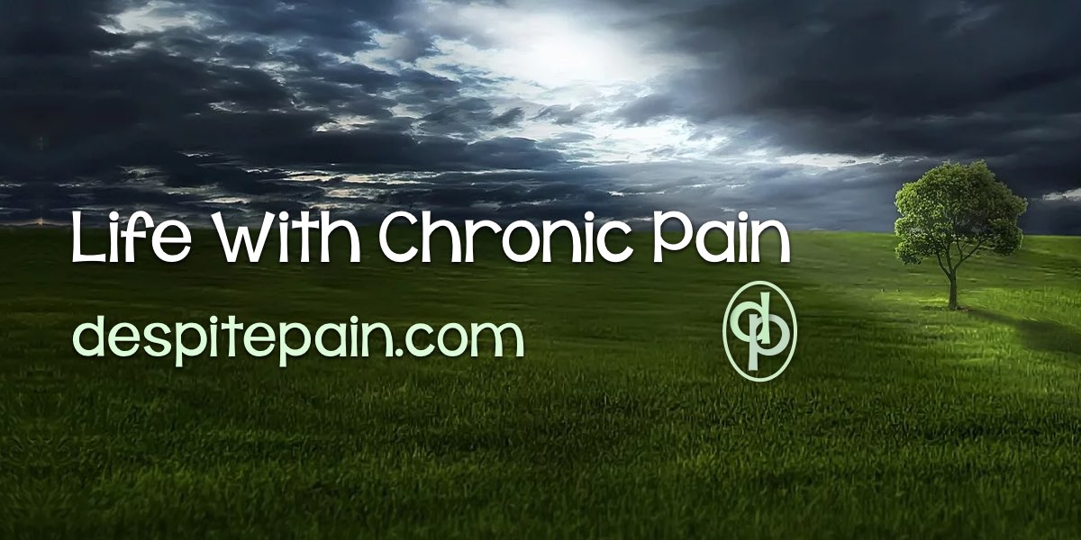 Life with Chronic Pain. Photo of grass, one tree and a dark sky with the light coming through clouds