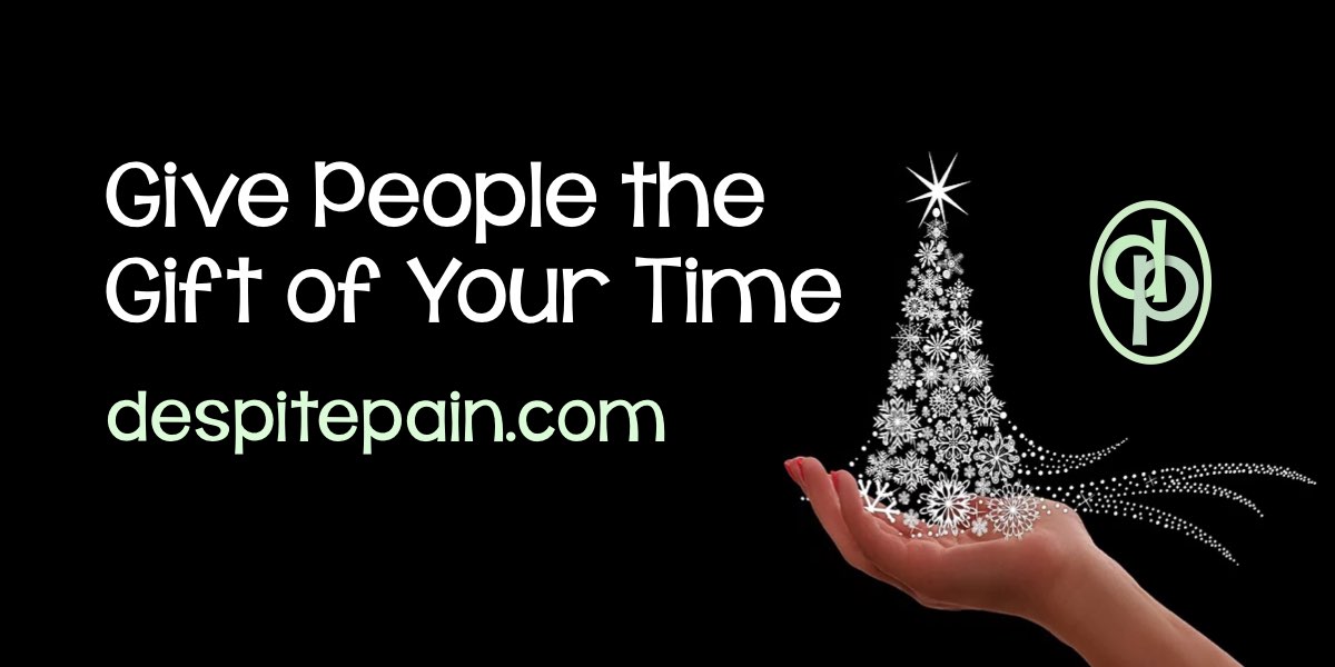 Give people the gift of your time this Christmas. White tree made from snowflake shapes on a hand with a black background