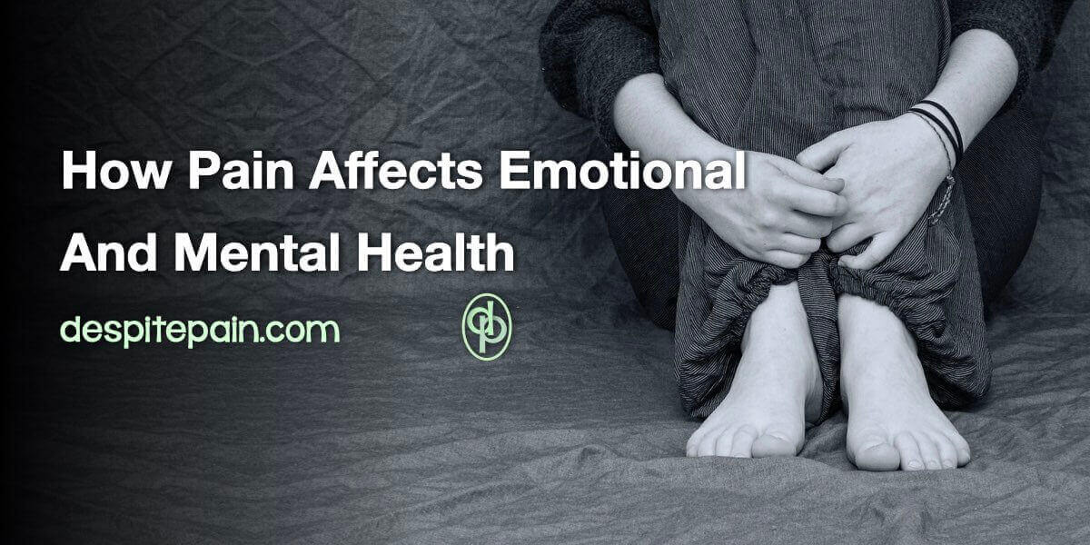 How pain affects emotional and mental health. A black and white image showing the lower half of a person sitting on the floor with their hands clasped around their legs..